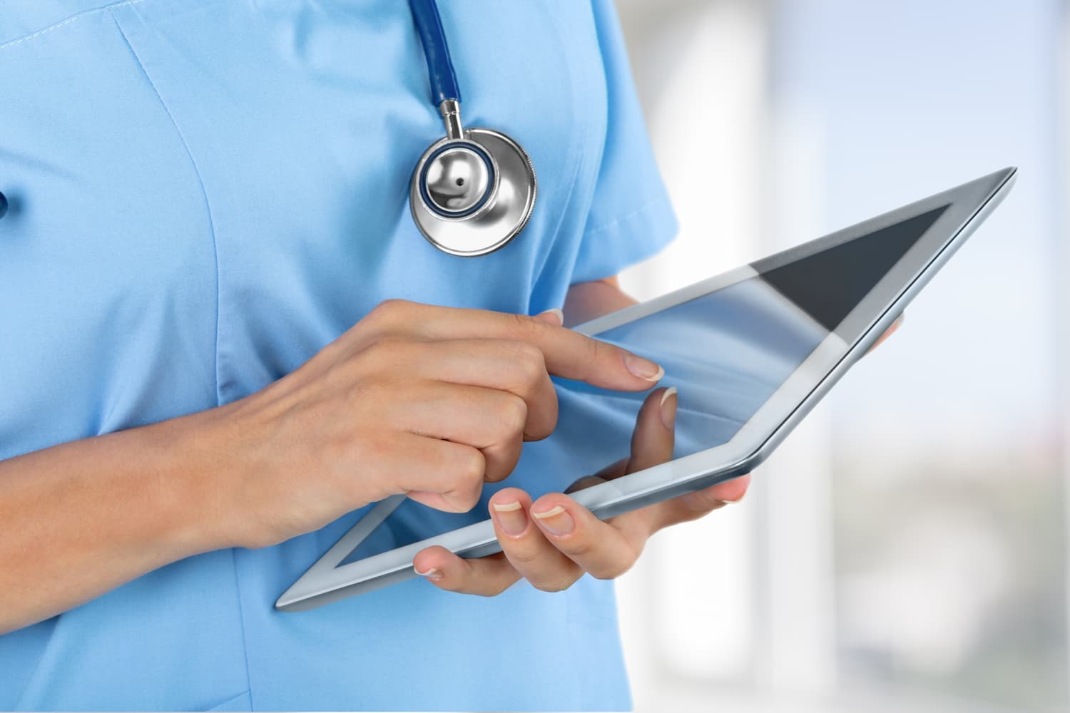 Doctor using tablet computer
